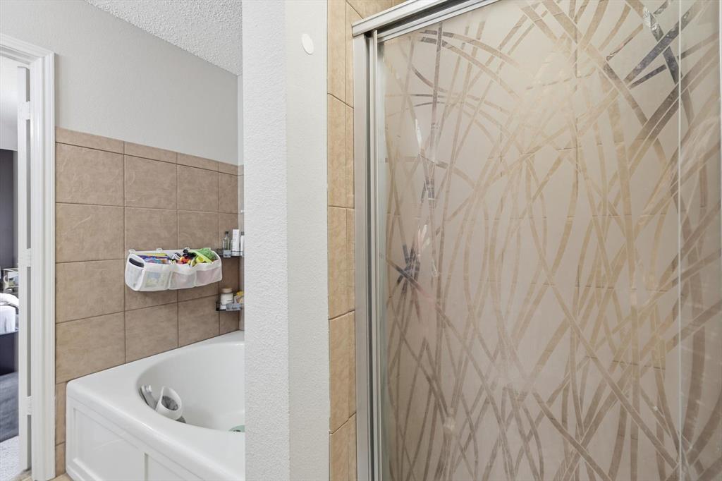 205 Comanche Trail Krum, TX 76249 - Photo 19 of 24 a bathroom with a tub