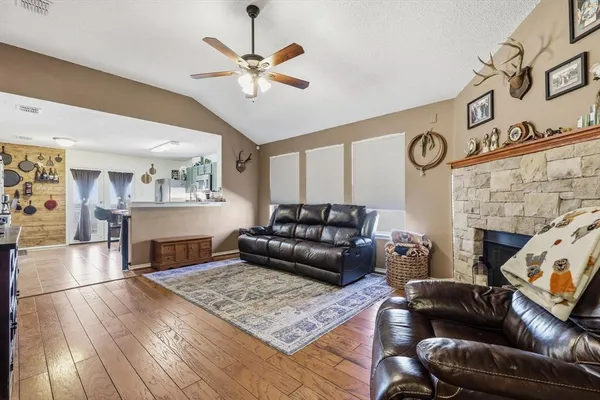 a living room with furniture and a fireplace
