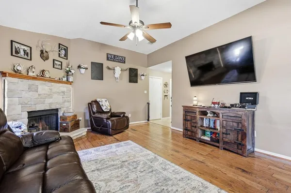 a living room with furniture and a flat screen tv