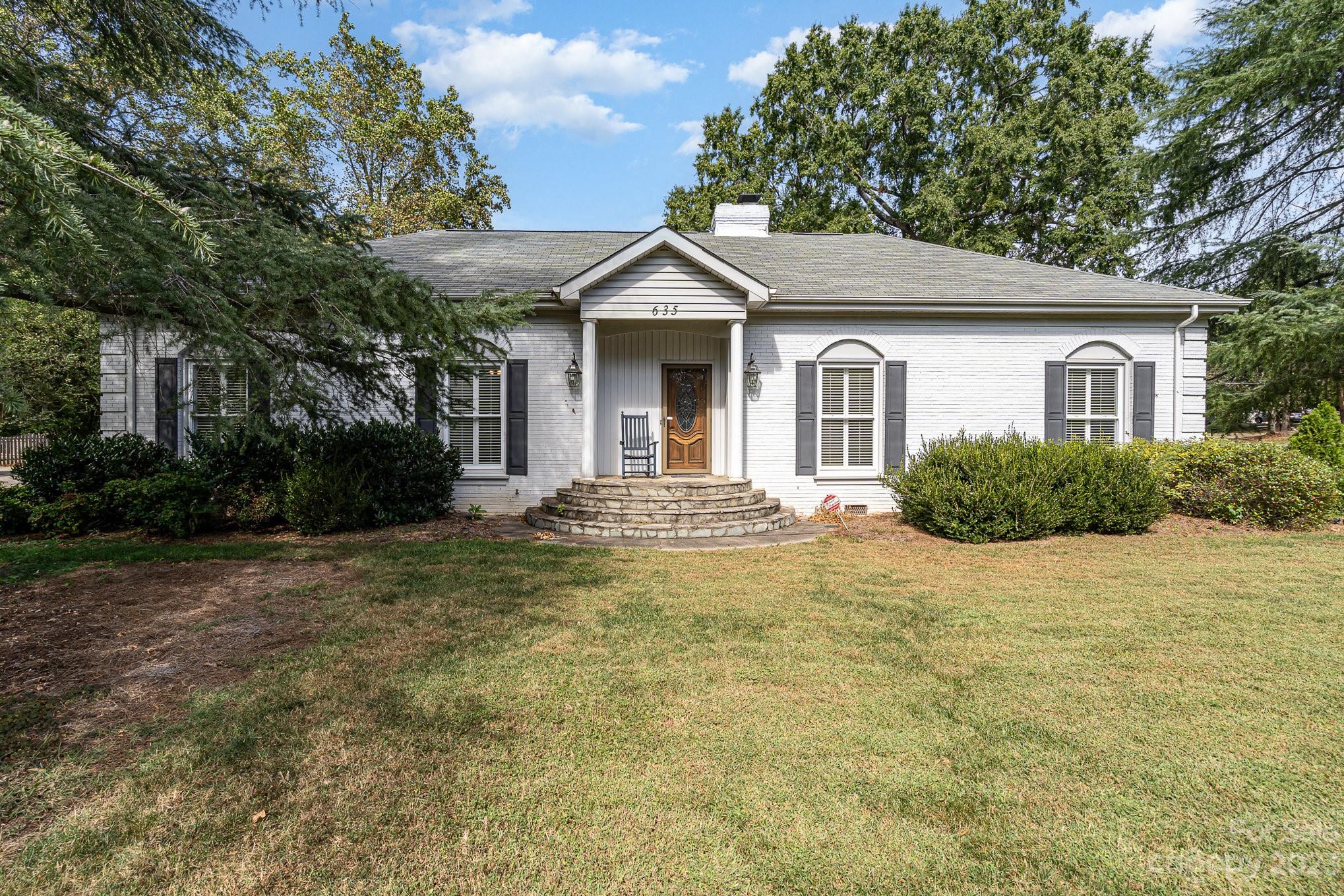 635 North Sharon Amity Road Charlotte, NC 28211 - Photo 1 of 31 a view of a house with a yard and large tree