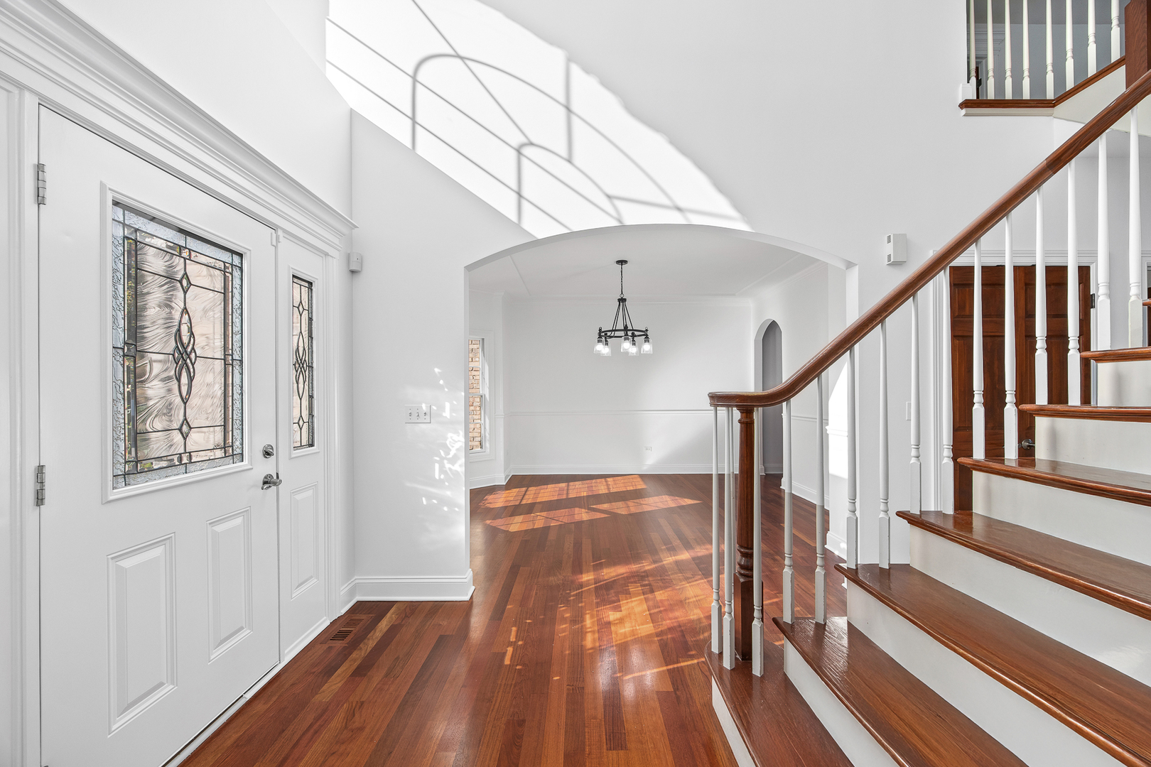 12929 Alpine Way Plainfield, IL 60585 - Photo 15 of 55 a view of hallway with wooden floor and stair