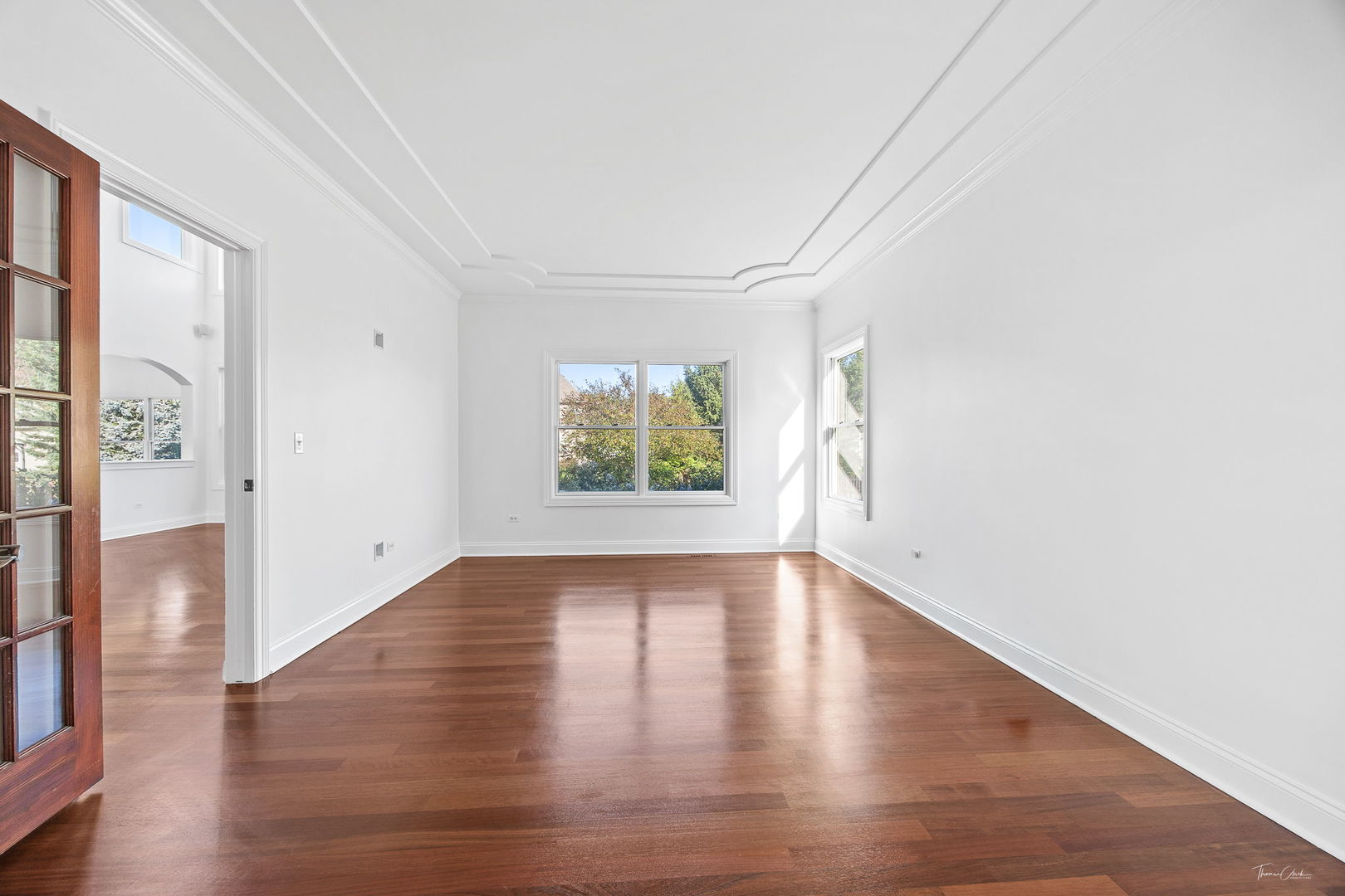 12929 Alpine Way Plainfield, IL 60585 - Photo 18 of 55 an empty room with wooden floor and windows