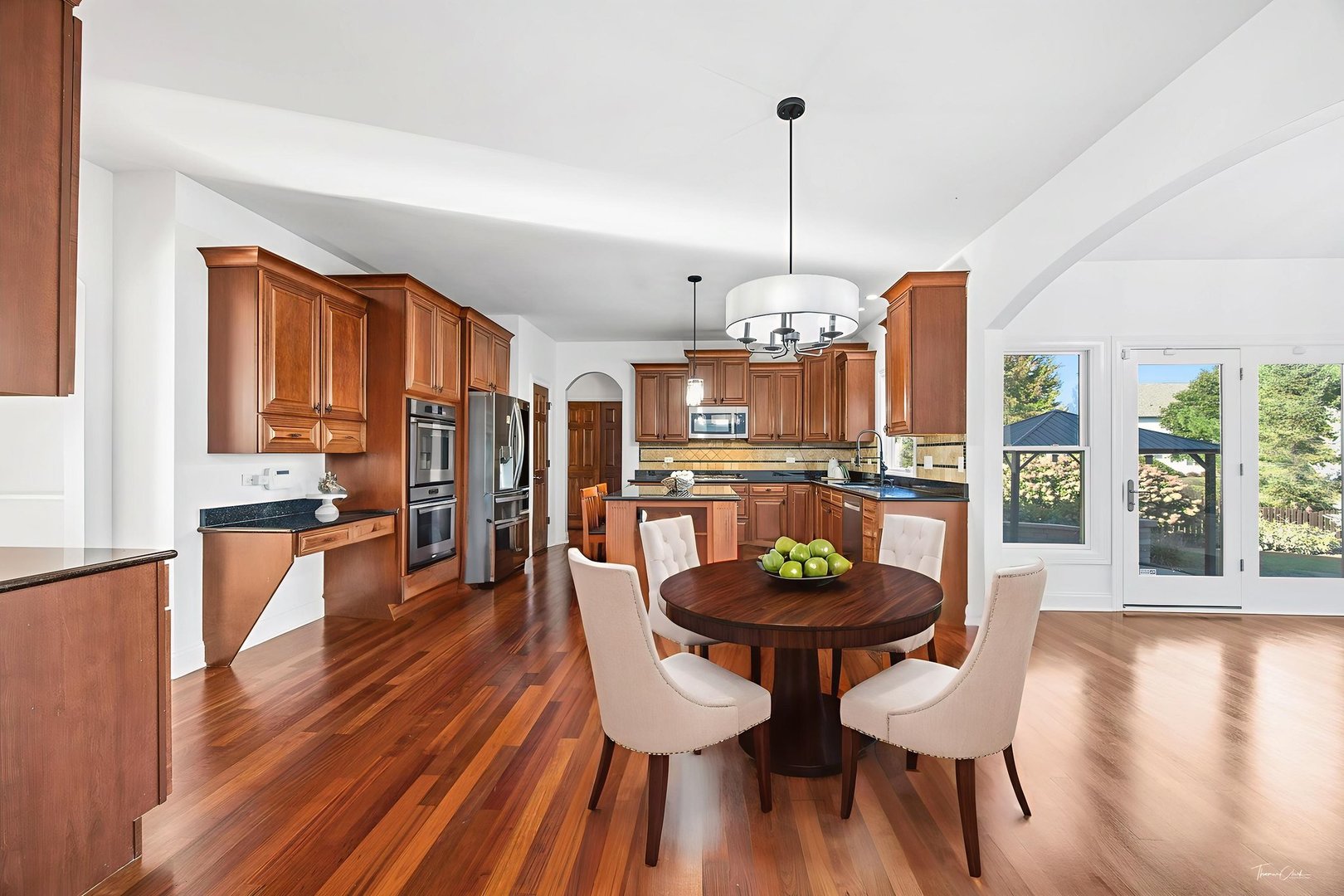 12929 Alpine Way Plainfield, IL 60585 - Photo 23 of 55 a dining room with furniture and wooden floor