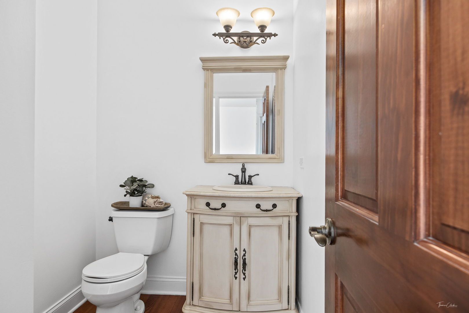 12929 Alpine Way Plainfield, IL 60585 - Photo 30 of 55 a bathroom with a toilet sink and mirror