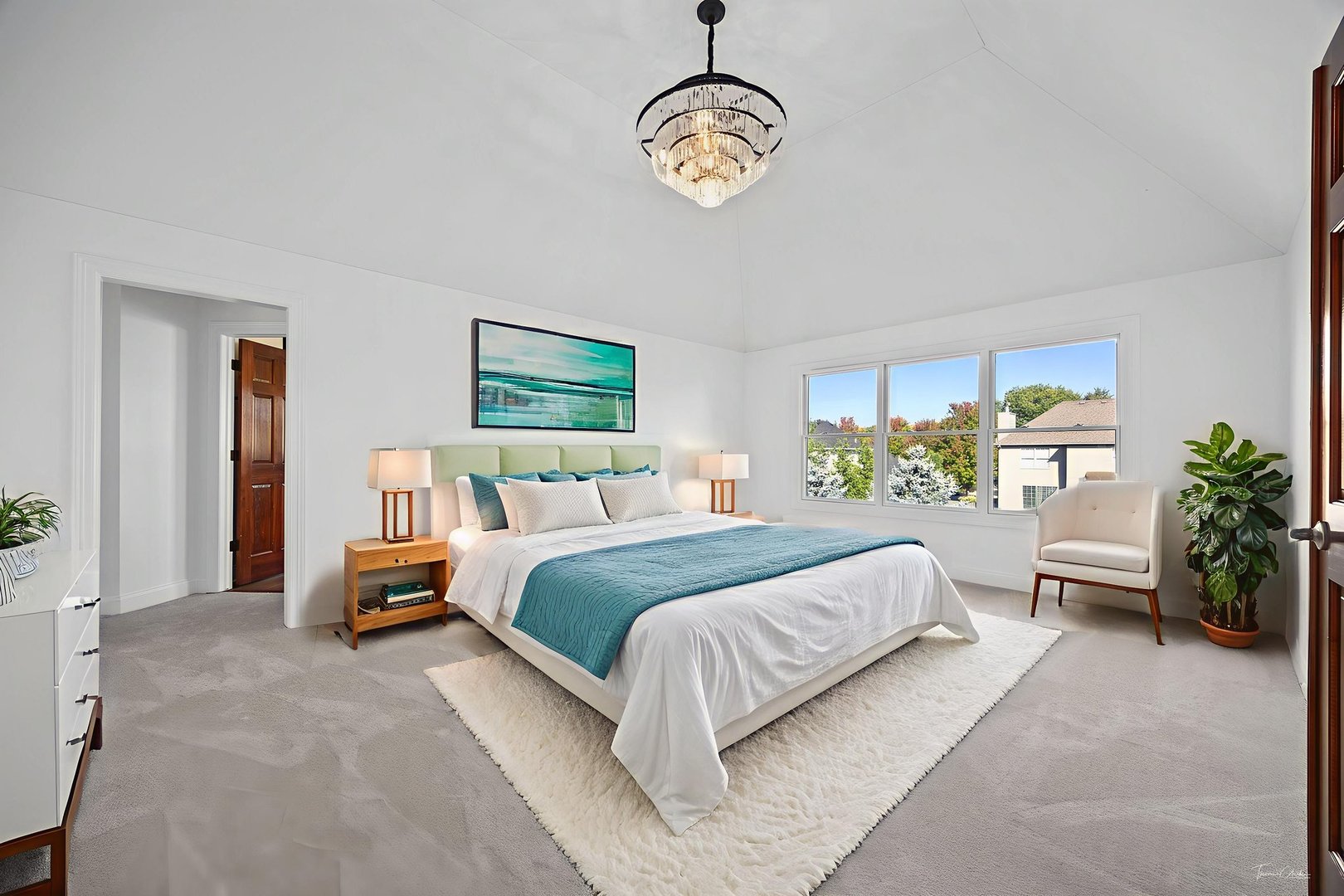 12929 Alpine Way Plainfield, IL 60585 - Photo 33 of 55 a spacious bedroom with a bed and a chandelier