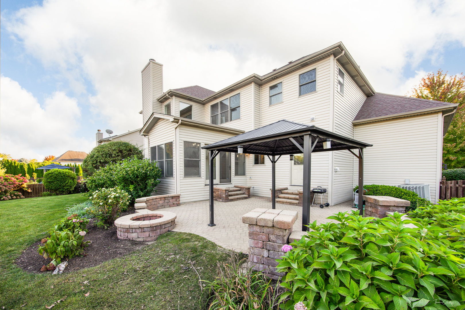 12929 Alpine Way Plainfield, IL 60585 - Photo 5 of 55 a front view of a house with garden
