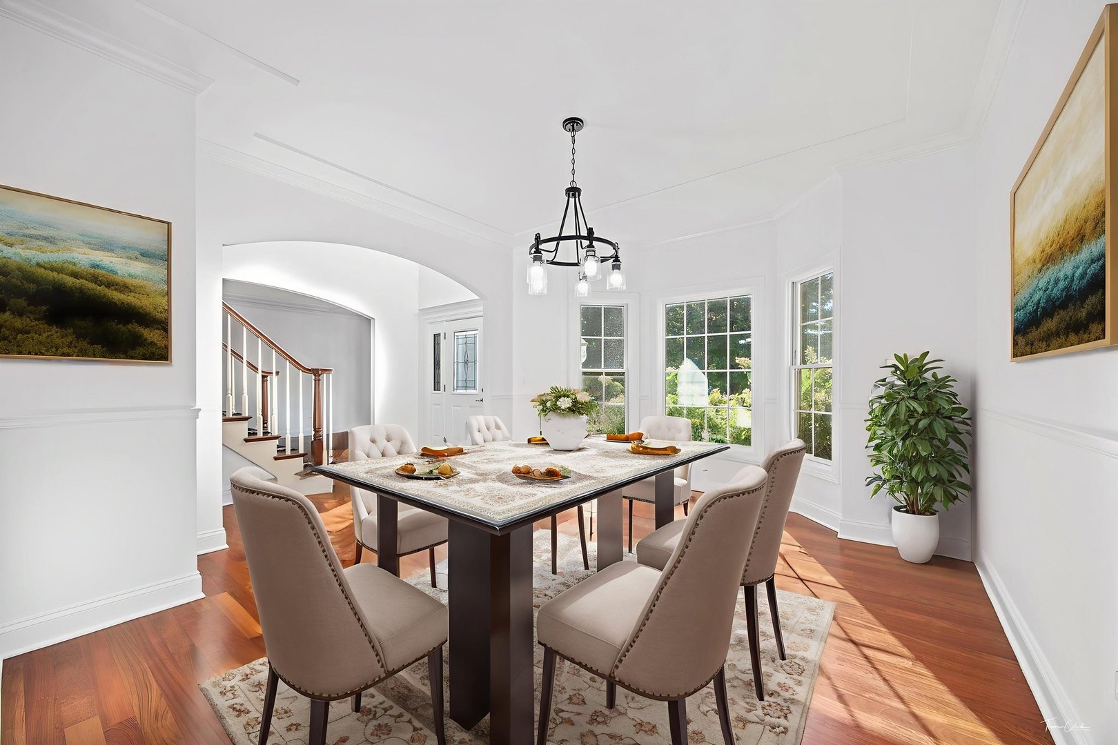 12929 Alpine Way Plainfield, IL 60585 - Photo 8 of 55 a dining room with furniture a chandelier and wooden floor