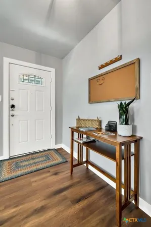 a view of workspace with wooden floor