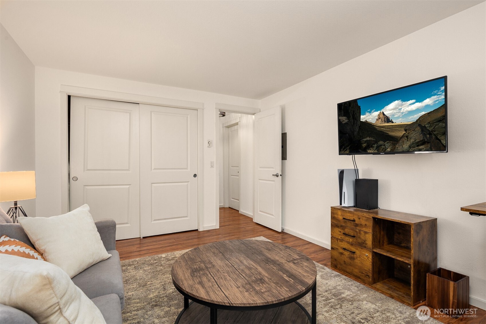 215 9th Street, Unit D102 Kirkland, WA 98033 - Photo 19 of 29 a living room with furniture and a flat screen tv