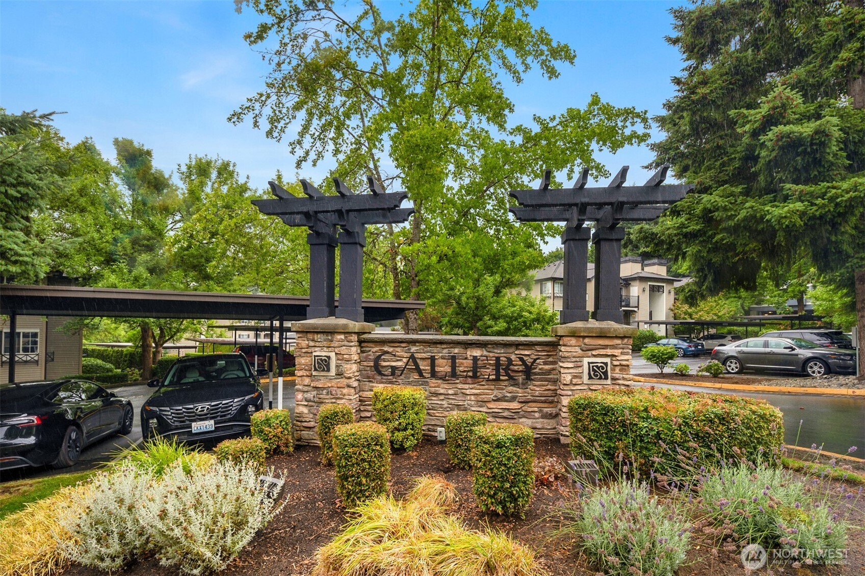 215 9th Street, Unit D102 Kirkland, WA 98033 - Photo 29 of 29 a view of a swimming pool with a patio and a garden