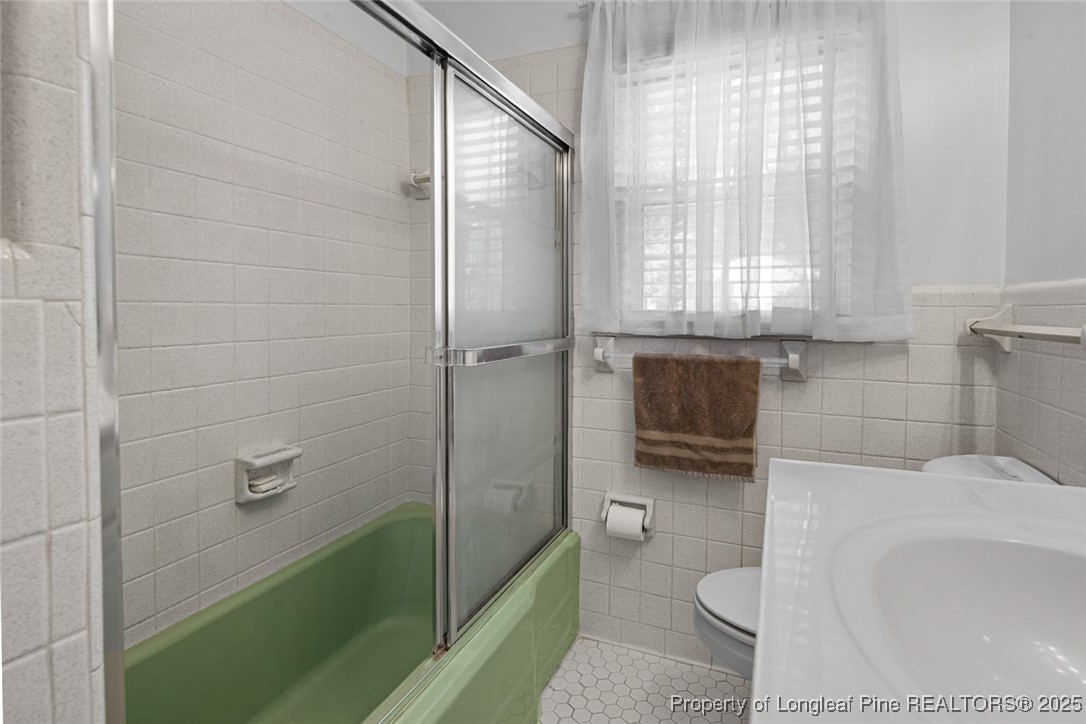 613 East 3rd Avenue Red Springs, NC 28377 - Photo 12 of 37 a bathroom with a shower and toilet