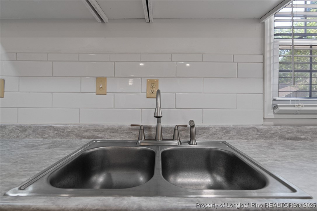 613 East 3rd Avenue Red Springs, NC 28377 - Photo 25 of 37 a sink with a and window