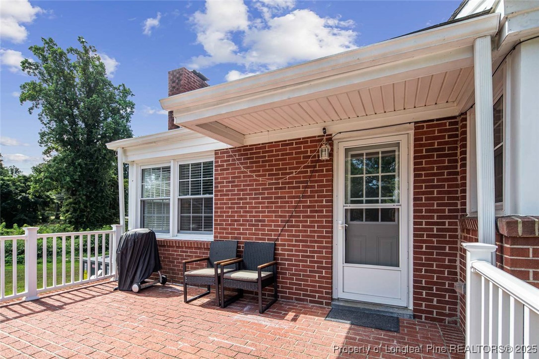 613 East 3rd Avenue Red Springs, NC 28377 - Photo 31 of 37 a view of a patio with a table and chairs