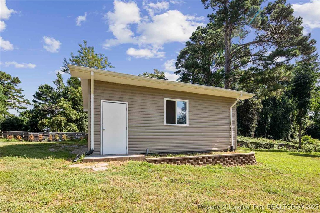 613 East 3rd Avenue Red Springs, NC 28377 - Photo 33 of 37 a backyard of a house with lots of green space