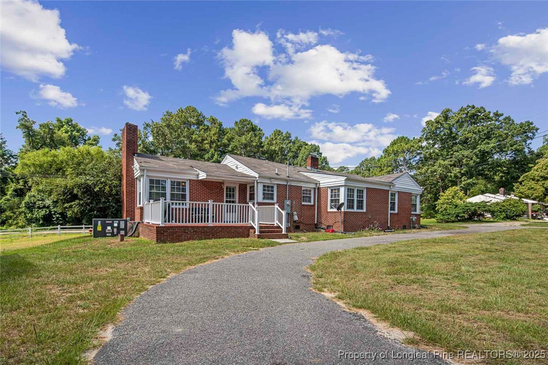 613 East 3rd Avenue Red Springs, NC 28377 - Photo 35 of 37 front view of a house with a big yard