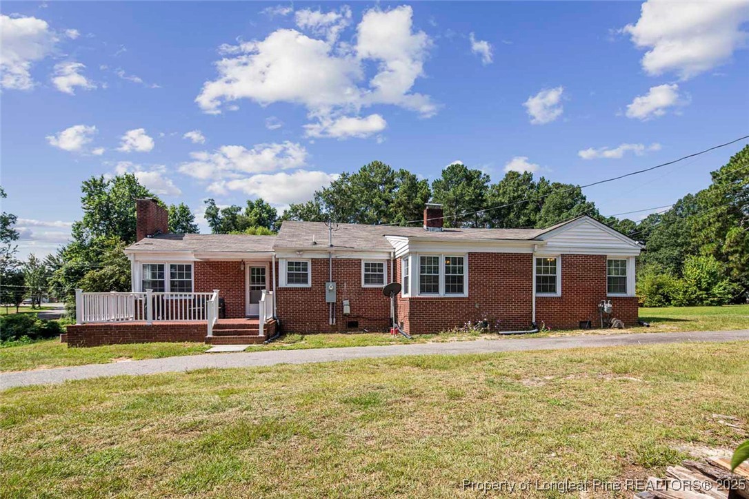 613 East 3rd Avenue Red Springs, NC 28377 - Photo 37 of 37 a front view of house with yard and swimming pool