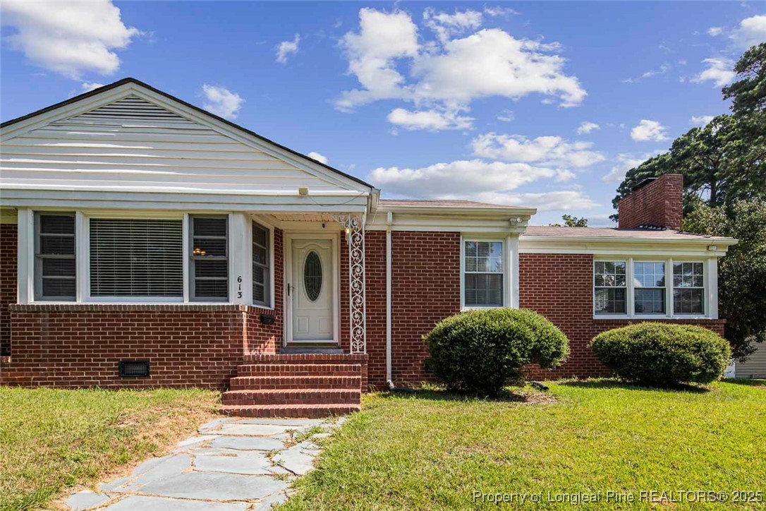 613 East 3rd Avenue Red Springs, NC 28377 - Photo 5 of 37 a view of a house with backyard and plants