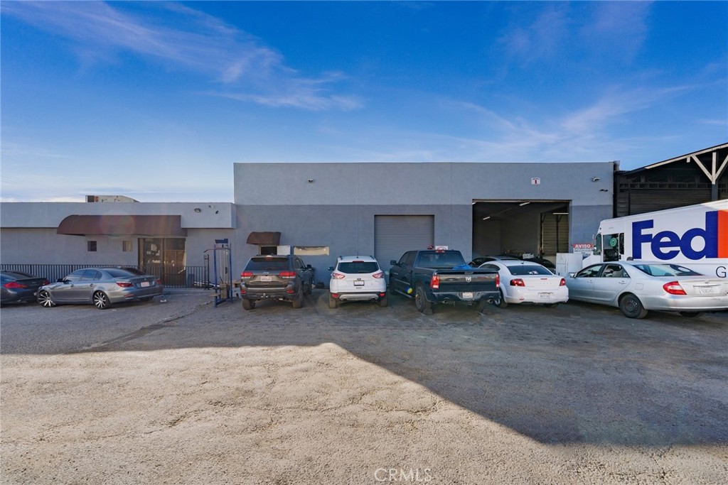 544 West Rialto Avenue Rialto, CA 92376 - Photo 2 of 15 a view of cars parked in a parking