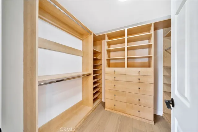 a bathroom with a double vanity sink and a large mirror