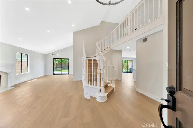 a view of an entryway with wooden floor