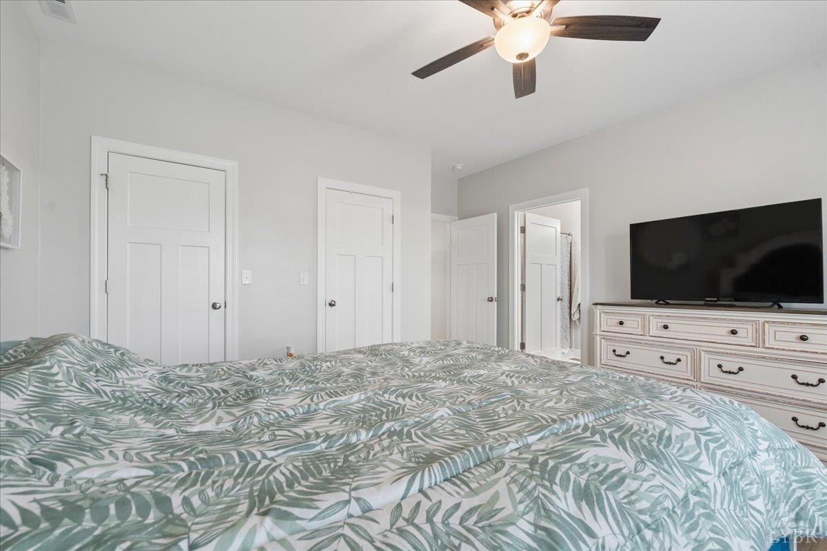 578 Collins Ferry Road Gladys, VA 24554 - Photo 13 of 36 a bedroom with a bed and a flat screen tv