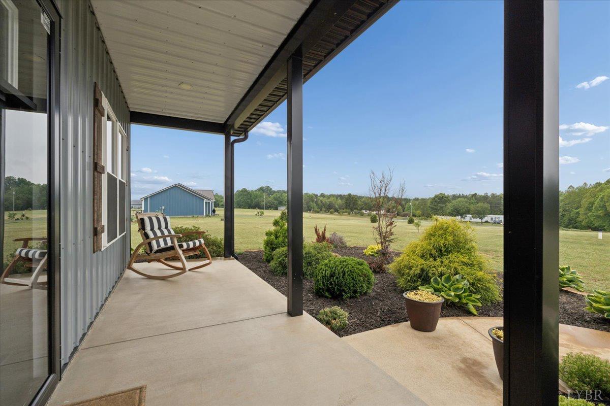 578 Collins Ferry Road Gladys, VA 24554 - Photo 21 of 36 a view of a balcony with lake view and a potted plant