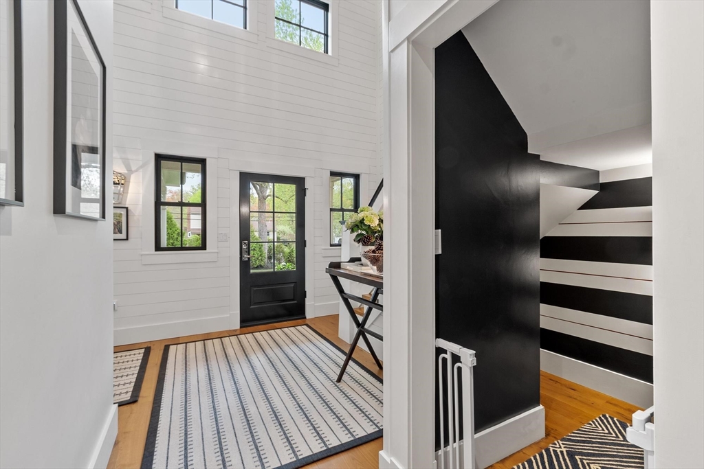 653 Main Street Concord, MA 01742 - Photo 21 of 42 a view of a hallway with wooden floor and entryway