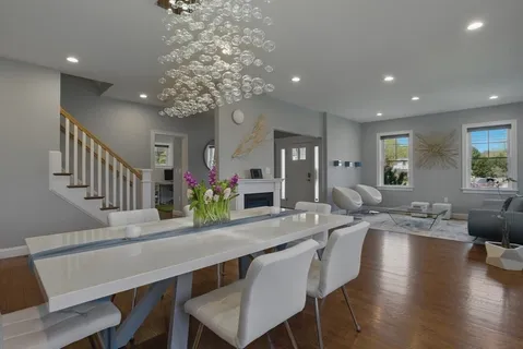 a view of a dining room with furniture window and wooden floor