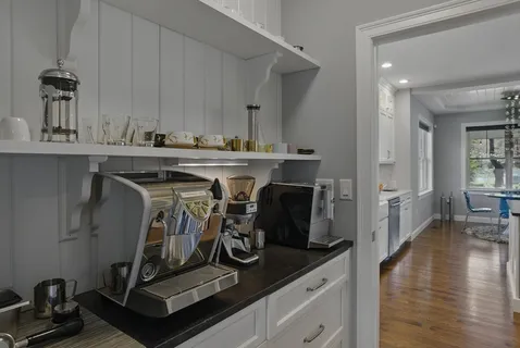 a view of a kitchen with appliances and cabinets