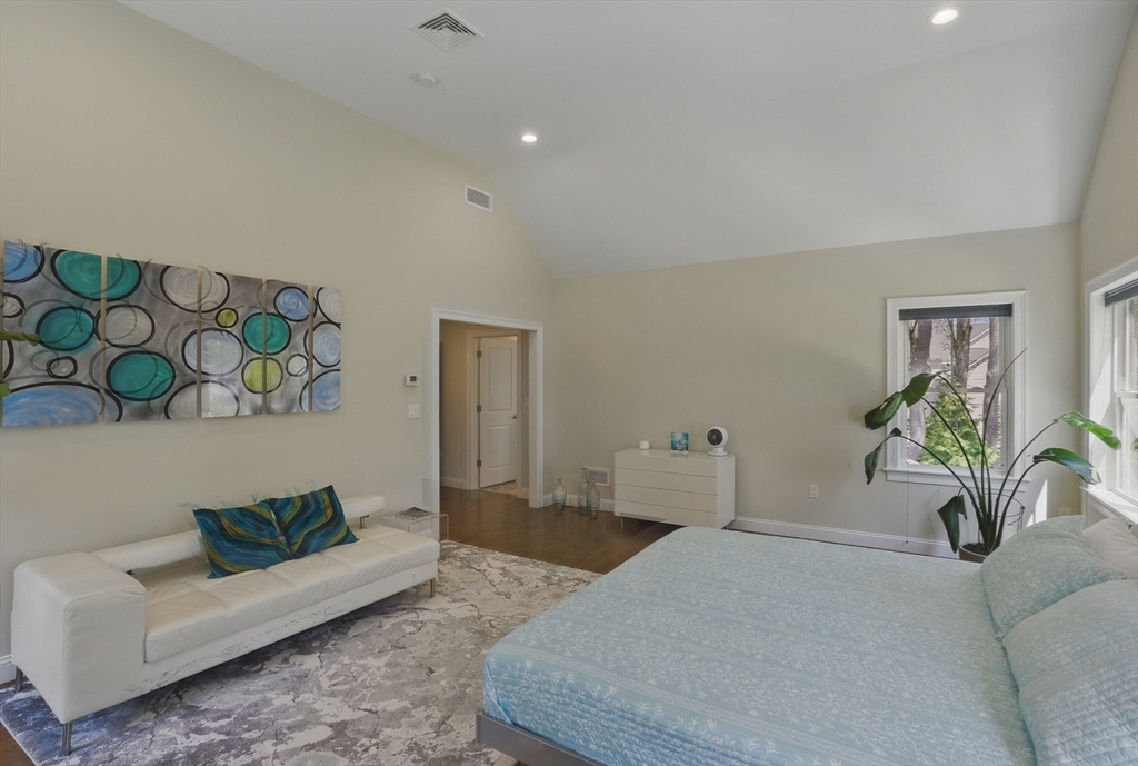 186 Concord Road Bedford, MA 01730 - Photo 20 of 40 a bedroom with a bed and a couch