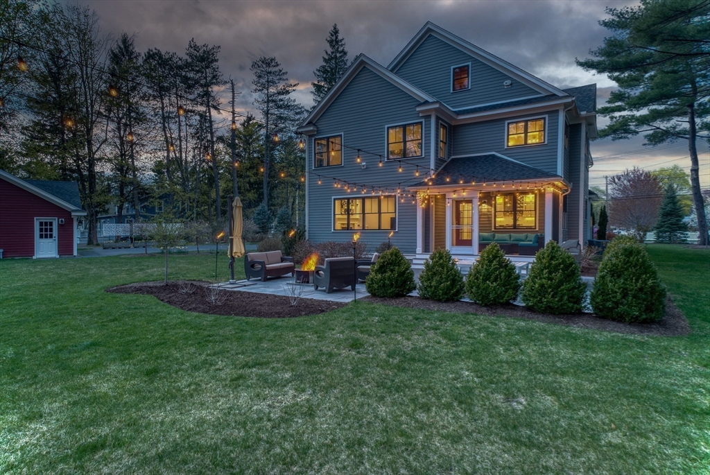 186 Concord Road Bedford, MA 01730 - Photo 30 of 40 a front view of a house with garden