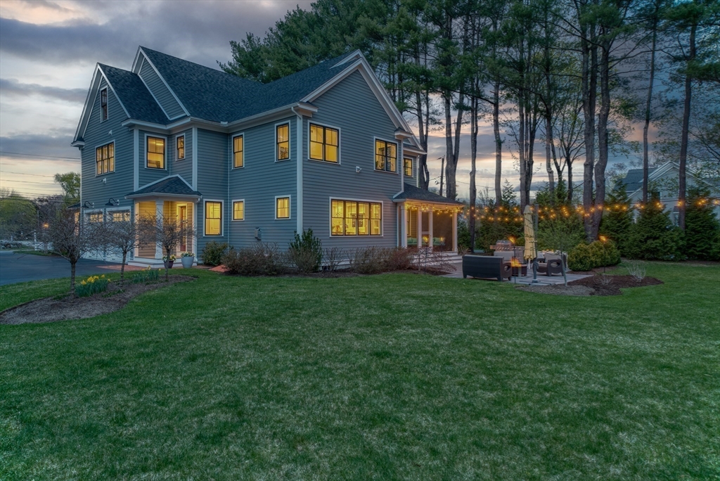 186 Concord Road Bedford, MA 01730 - Photo 31 of 40 a front view of a house with garden