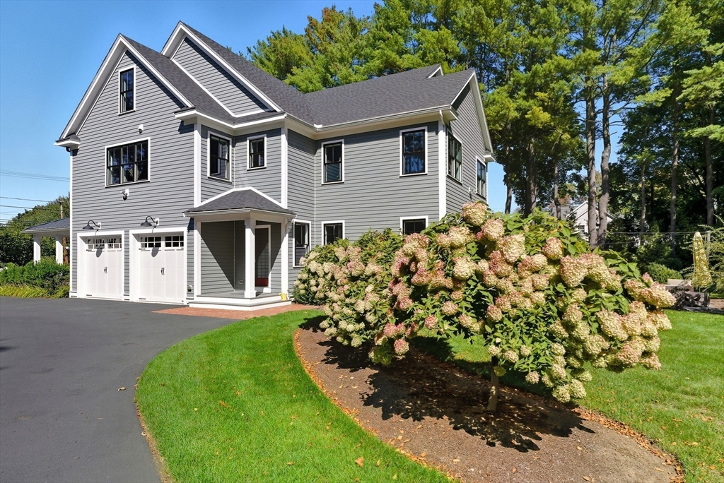 186 Concord Road Bedford, MA 01730 - Photo 35 of 40 front view of a house with a yard