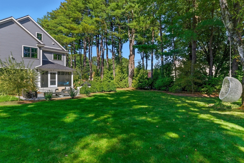 186 Concord Road Bedford, MA 01730 - Photo 36 of 40 a view of a house with a backyard