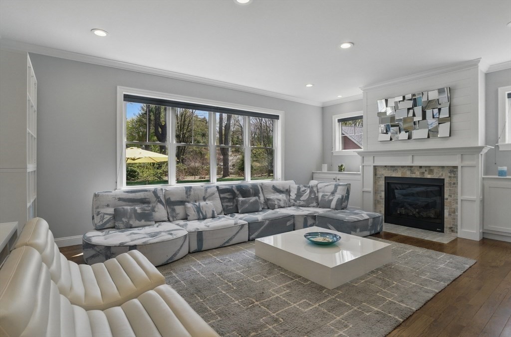 186 Concord Road Bedford, MA 01730 - Photo 9 of 40 a living room with furniture and a fireplace
