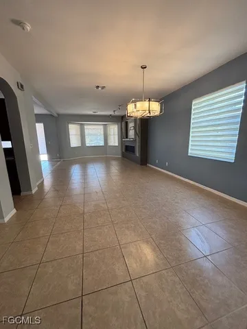 a view of a kitchen with a sink and a window