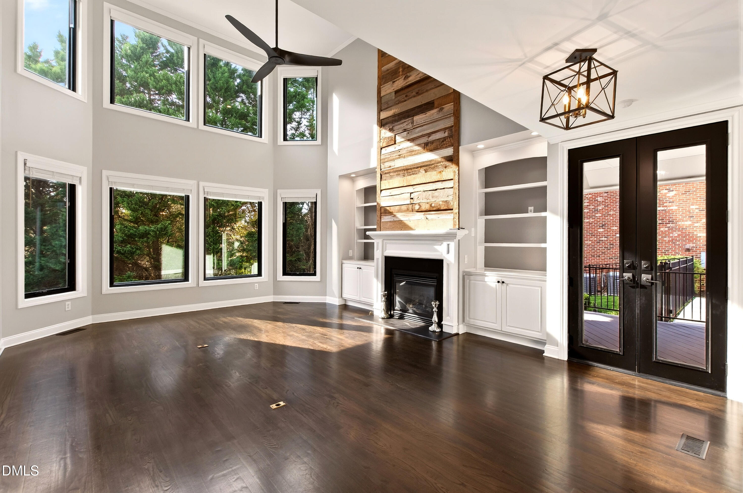 12408 Cilcain Court Raleigh, NC 27614 - Photo 24 of 80 a view of livingroom with furniture wooden floor fireplace and windows
