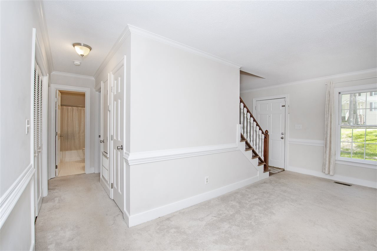 6909 Sandringham Drive Raleigh, NC 27613 - Photo 6 of 24 Hallway to two downstairs bedrooms