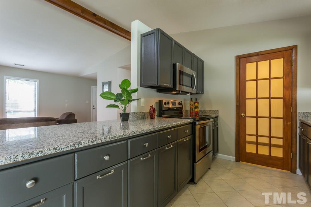 4517 Brost Court Raleigh, NC 27616 - Photo 2 of 11 Well equipped kitchen with GRANITE tops, STAINLESS STEEL appliances, RESURFACED cabinetry, BRUSHED NICKEL hardware. Check out the WIC PANTRY! Hard to find these UPGRADES and this SPACE at this GREAT price!