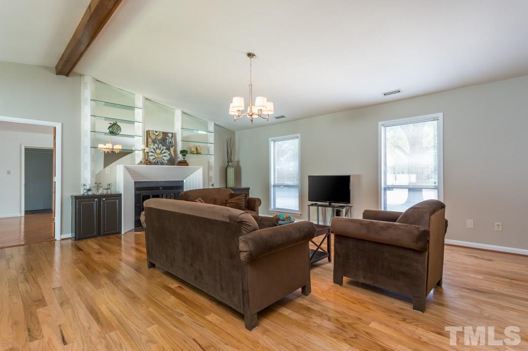 4517 Brost Court Raleigh, NC 27616 - Photo 3 of 11 HARDWOODS throughout. SOARING vaulted ceilings! UPDATED lighting. FRESHLY PAINTED in designer neutral palette. Just PLUG-IN and PLAY!