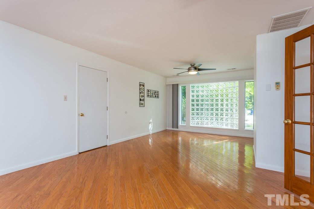 4517 Brost Court Raleigh, NC 27616 - Photo 5 of 11 EASY ACCESS to garage, backyard, and 2nd fl BONUS. This space with GLEAMING HARDWOODS can FLEX for FORMAL Living room or GRAND Dining hall for the HOLIDAYS. Use your imagination-- there's ROOM for it!