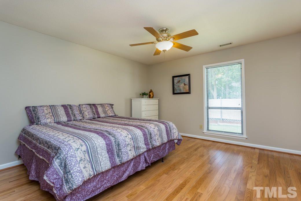 4517 Brost Court Raleigh, NC 27616 - Photo 7 of 11 UPDATED ceiling fan, DESIGNER NEUTRAL paint, and HARDWOODS complete your master bedroom. RELAX, all the work is DONE!