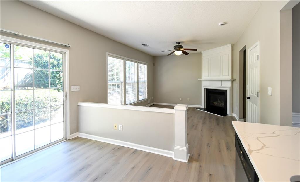 3905 Timbercreek Circle Roswell, GA 30076 - Photo 12 of 30 wooden floor in an empty room with a window