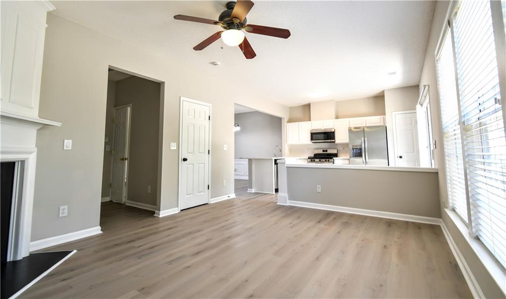 3905 Timbercreek Circle Roswell, GA 30076 - Photo 14 of 30 a view of a kitchen with wooden floor and a window