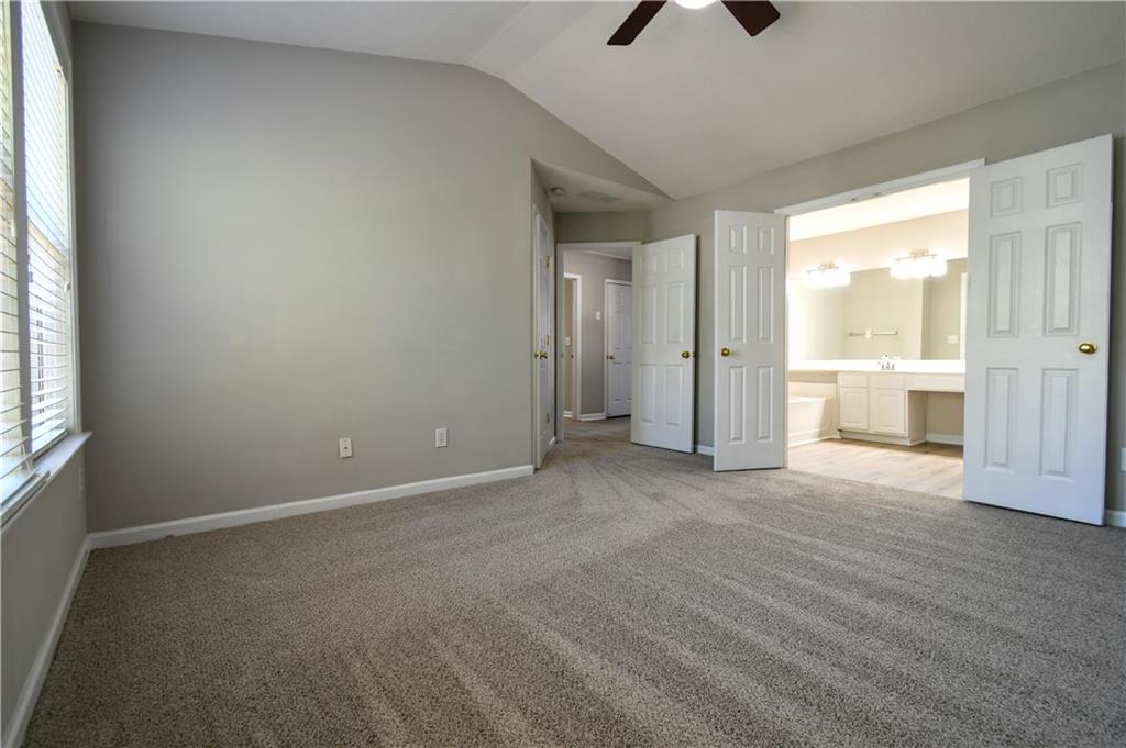 3905 Timbercreek Circle Roswell, GA 30076 - Photo 19 of 30 an empty room with closet and windows