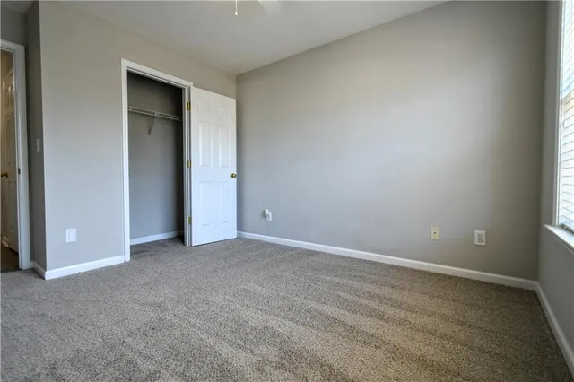 an empty room with closet area