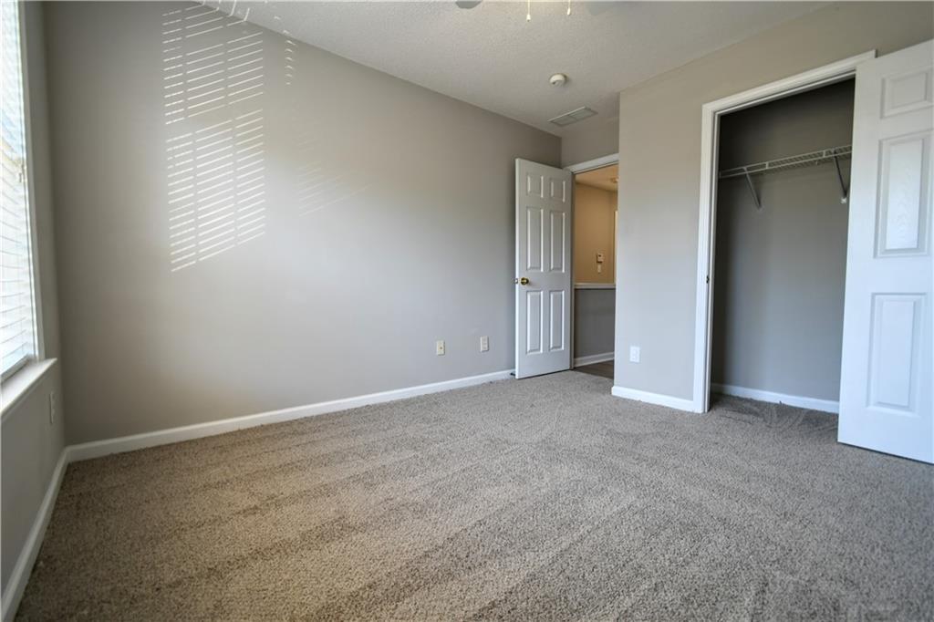 3905 Timbercreek Circle Roswell, GA 30076 - Photo 28 of 30 an empty room with windows and closet