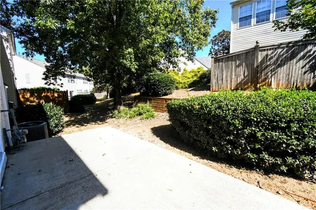 a view of a backyard of the house