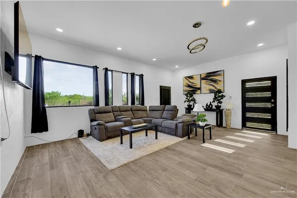 a living room with furniture and a large window