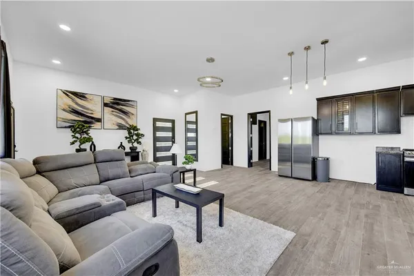a living room with furniture and a flat screen tv